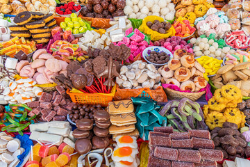 Traditional sweets: cookies, jelly, candy, chocolate, marshmallow, nuts and more at open market...