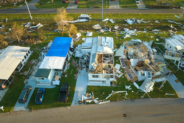 Destroyed by hurricane Ian suburban houses in Florida mobile home residential area. Consequences of...
