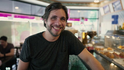 Fototapeta premium Happy young man smiling at camera. Handsome 30 male person portrait face closeup