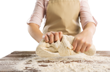 Making dough by female hands. Woman cooking.
