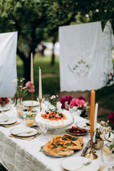 party table details. details of a decorated place for a festive event. table details with flowers and snacks for outdoors holiday	
