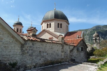 Fototapeta na wymiar Ancient stone church in Kotor, Montenegro. Kotor is a beautiful historic city on the Unesco list. 