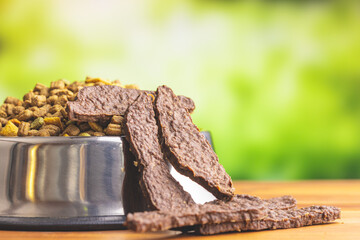 Dried meat for dogs. Chewy treat for dogs and dried kibble.