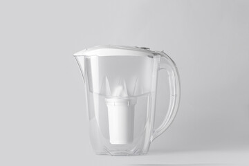 Water filter jug on light background