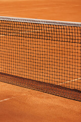 tennis net court made of red clay soil with markings for game or competition. sports and recreation, professional performance champions lawn tennis with rackets and balls. training athletes outdoor