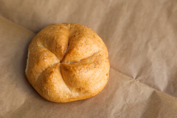Kaiser roll on parchment paper