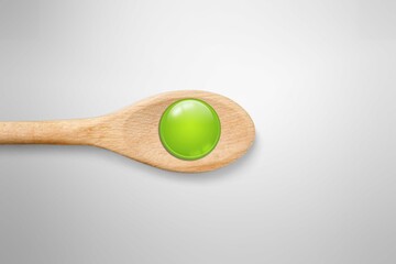Vitamin D concept, a spoon on the desk background