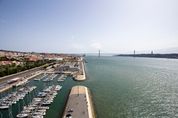 Fototapeta na wymiar View of the 25th of April Bridge from the Monument of the Discoveries on a summer day in Lisbon