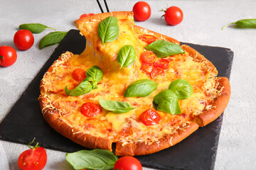 Board of tasty pizza margarita with stretching cheese on table, closeup