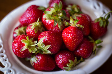 Strawberries in a white bowl.