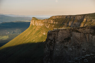 Spring landscape of the Tologorri peak illuminated by the warm light of sunset in the Sierra de Gorobel, near Maroño, in the Ayala or Aiaraldea valley rural countryside, in Alava, Basque Country.