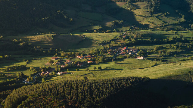 Landscape of the aerial view of the small town of Salmanton in the green and rural countryside environment of the Maro&ntilde;o reservoir, in the Ayala or Aiaraldea valley, Alava, Basque Country.