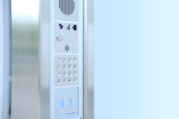 outdoor modern wireless interphone in front of office, intercom to communicate with visitors,...