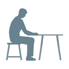 One silhouette sitting at desk, working hard