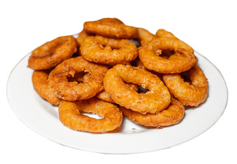 Fried golden calamari rings on a white plate isolated