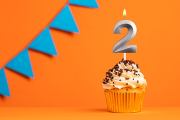 Candle number 2 - Cake birthday in orange background