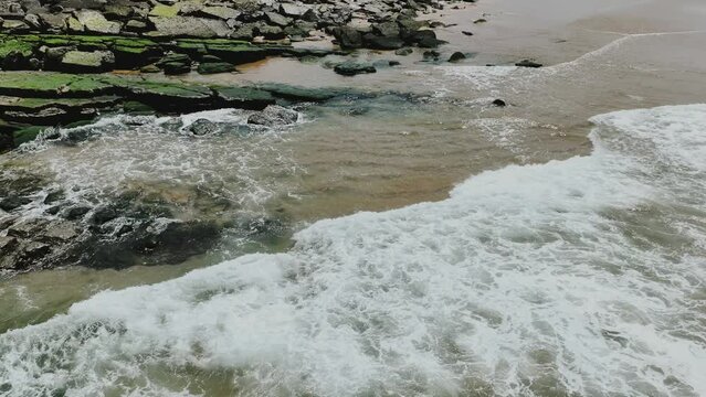 The waves of the Atlantic Ocean crash against the cliffs 4k