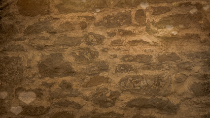 Part of the old natural stone wall in brown. Can be used for vintage wallpaper. Copy space