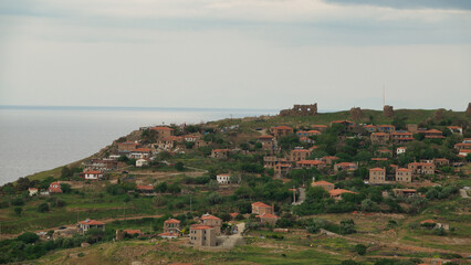 Obraz premium Kaleköy village, formerly known as Kastro, old stone houses and Samothrace view from Gokceada, Canakkale Turkey