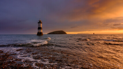 Winter sunrise on Trwyn Du Lighthouse at Penmon Point, Anglesey, Wales