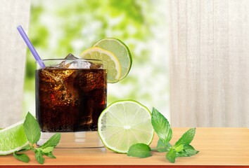 Whiskey with cola drink cocktail and lemon ice.