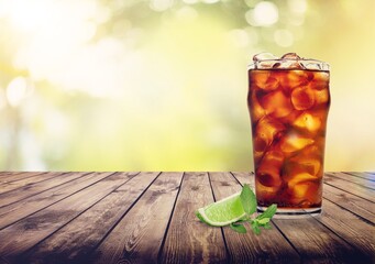 Whiskey with cola drink cocktail and lemon ice.