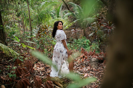 woman wearing a dress in the tropical jungle