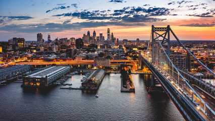Aerial panorama with Ben Franklin Bridge and Philadelphia skyline at dusk. Ben Franklin Bridge is a...