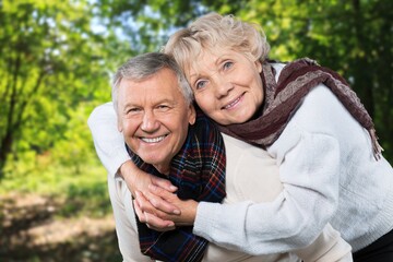Fototapeta premium Portrait of old cheerful people walking in forest
