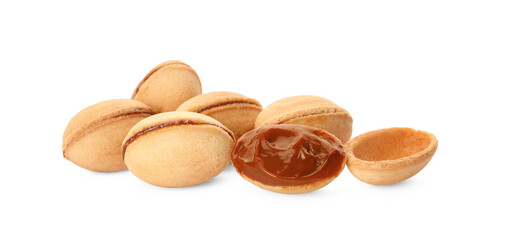 Delicious nut shaped cookies with boiled condensed milk on white background