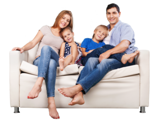 Happy family sitting on the sofa smiling at camera