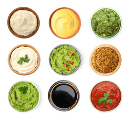 Set of guacamole and different sauces on white background, top view