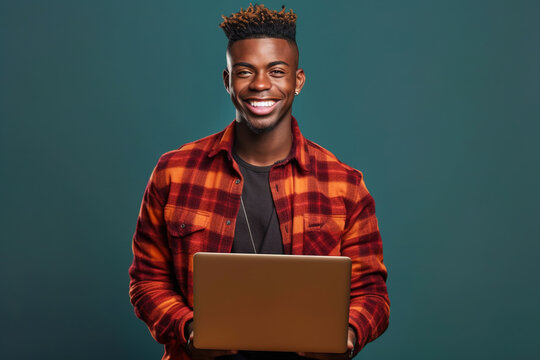 Young Black Man Uses Laptop, Smiling Handsome Guy Works On Computer, Generative AI.