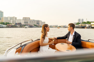 Caucasian couple enjoy urban outdoor lifestyle travel city on luxury private boat yacht sailing in...