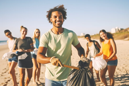 Young man picking up trash with group of volunteers and activists on the beach. Generative AI