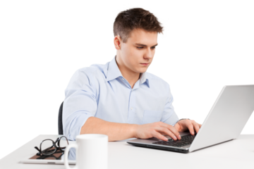 Handsome young businessman working with laptop in office