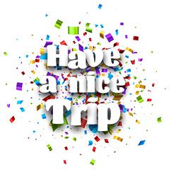 Have a nice trip sign over colorful cut ribbon confetti background.