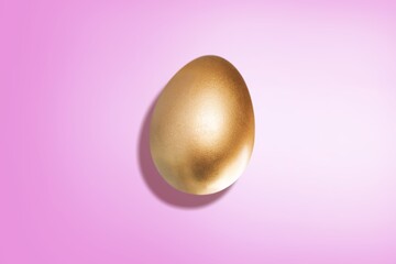 Easter concept with golden egg on color background