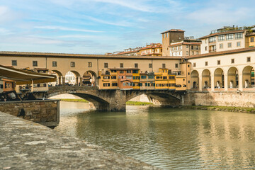 Fototapeta na wymiar The Ponte Vecchio is the only bridge in Florence spared from destruction during the Second World War. It has shops built along it.