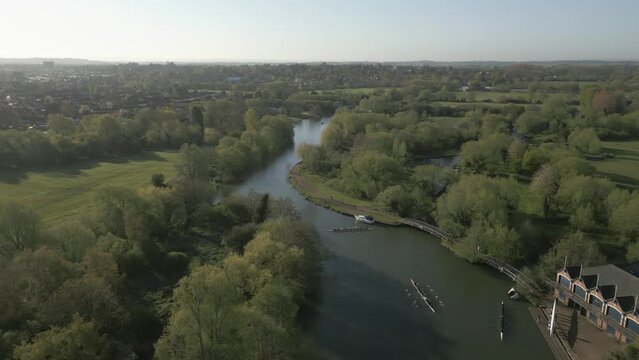 Aerial Pull back over River with Rowing boats in Oxford, UK, Sunny.