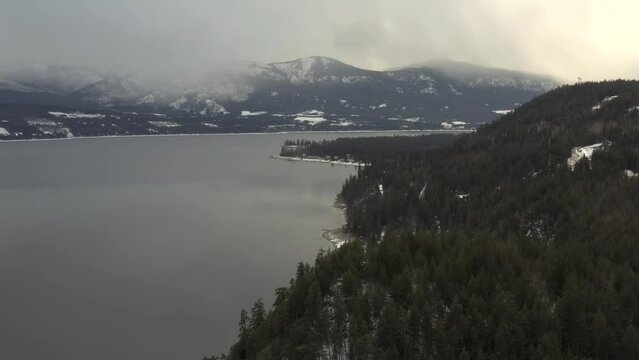 Cloudy Day Reflections: Aerial Footage of Shuswap Lake's Pristine Serenity in Scotch Creek