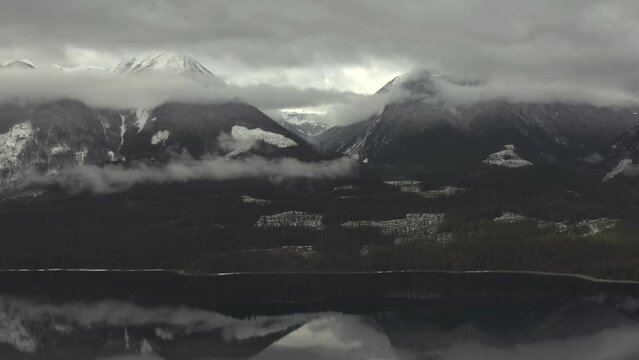 Above the Wilderness: Aerial Odyssey through Clouds, Forests, and Mirror-like Waters of Slocan Lake