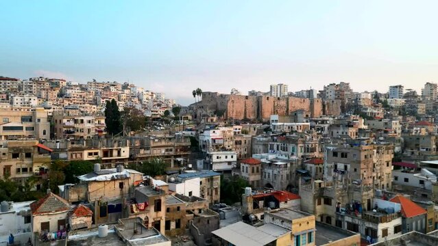 Drone shot rising up over huge dense city with poverty in Middle East