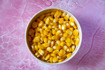 Bowl with loose kernels of steamed sweet corn