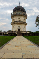 Fototapeta na wymiar Path leading to one of the tomb building in Qutb Shahi Archaeological Park, Hyderabad, India