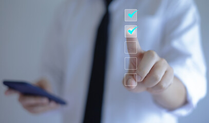 Businessman writing or making valid marks to approve documents and project ideas.