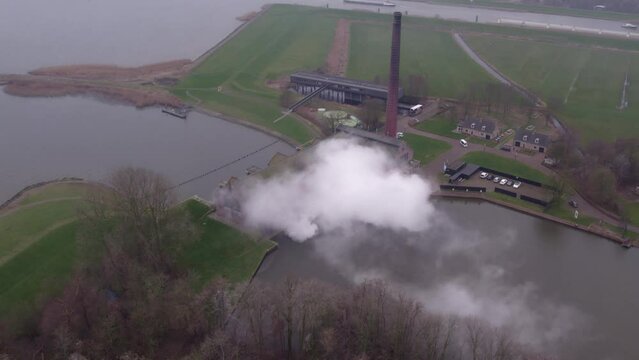 Cloudy morning at The Woudagemaal Lemmer under steam, panoramic drone shot 4k