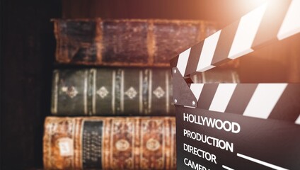 Books scenario concept. movie clapboard and books