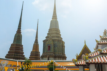 Fototapeta premium Combination of Thai and Chinese architecture. Pagoda decorated with Chinese tiles. Wat Pho, Temple, Bangkok, Thailand