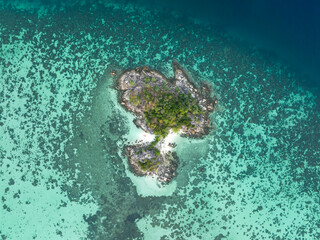 Bird 's eye view of summer tropical islands in the ocean -coral reef as white sand beach and turquoise water background.